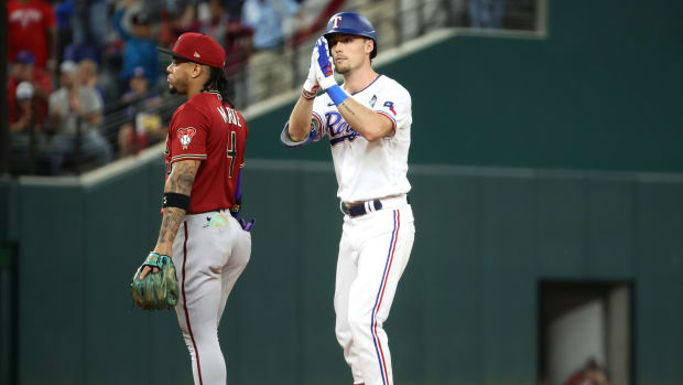 Oct 27, 2023; Arlington, TX, USA; Texas Rangers center fielder Evan Carter (32) reacts after a double during the third inning in game one of the 2023 World Series against the Arizona Diamondbacks at Globe Life Field. Mandatory Credit: Kevin Jairaj-USA TODAY Sports  